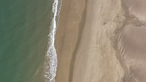 Espiguette-beach-mediterranean-sea-shore-aerial-flight-vertical-top-down-shot